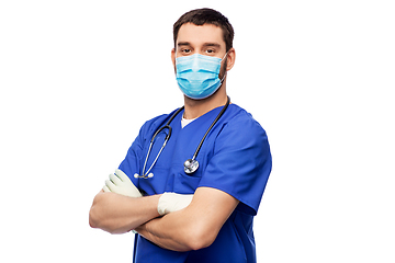 Image showing male doctor in blue uniform, mask and gloves