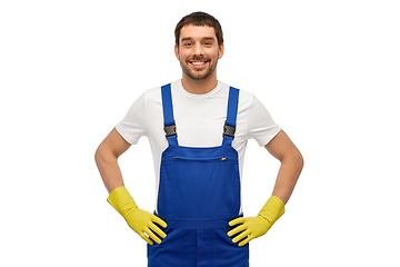 Image showing happy male worker or cleaner in overall and gloves