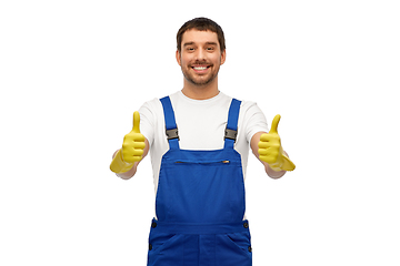 Image showing happy male worker or cleaner in overall and gloves