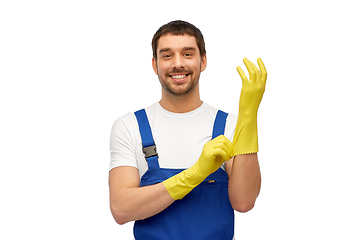 Image showing male worker or cleaner in overall wearing gloves