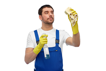 Image showing male cleaner cleaning with rag and detergent