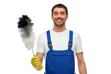 Image showing happy male worker or cleaner with duster cleaning