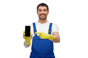 Image showing happy male worker or cleaner showing smartphone