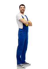 Image showing happy male worker or cleaner in overall and gloves