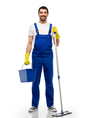 Image showing male cleaner cleaning floor with mop and bucket