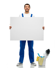 Image showing male cleaner with cleaning stuff and white board