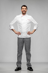 Image showing happy smiling male chef in jacket