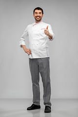 Image showing smiling male chef in jacket showing thumbs up