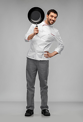 Image showing happy smiling male chef in jacket with frying pan