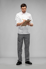 Image showing male chef with clipboard and pencil