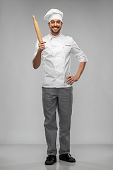 Image showing happy smiling male chef or baker with rolling pin