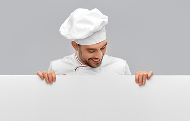 Image showing happy smiling male chef with big white board