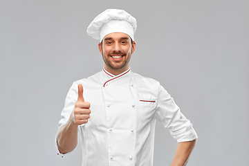 Image showing smiling male chef in toque showing thumbs up