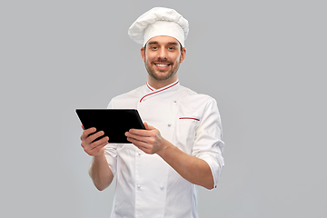 Image showing happy smiling male chef with tablet pc computer