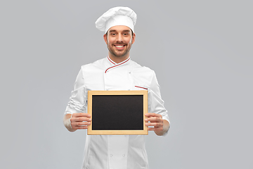 Image showing happy smiling male chef showing chalkboard