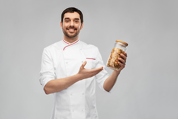 Image showing happy smiling male chef with pasta in glass jar