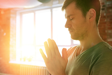 Image showing close up of man meditating at yoga studio