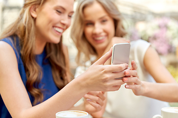 Image showing happy women with smartphone at street cafe