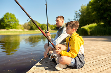 Image showing father and son fishing on river