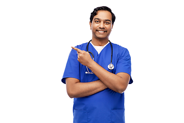 Image showing indian male doctor holding something on hand