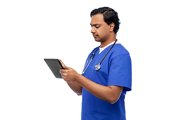 Image showing indian doctor or male nurse using tablet computer