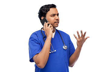 Image showing indian doctor or male nurse calling on smartphone