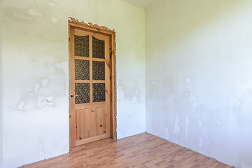 Image showing View of the front door in a small room with a fine finish after renovation