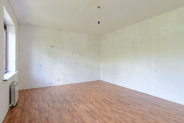 Image showing A fragment of the interior of a spacious empty room with a fine finish of the walls