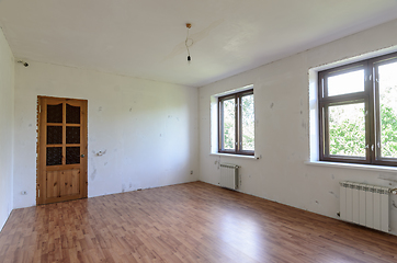 Image showing A fragment of a room with a fine finish, a view of the front door and windows