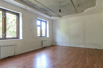 Image showing Interior of an empty room during renovation in the room two large windows