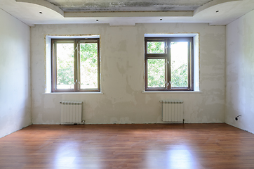 Image showing Interior of empty room during renovation, wall view with windows