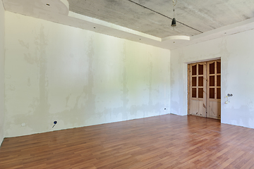Image showing Interior of an empty room with a final renovation under a wallpaper sticker