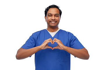 Image showing smiling indian male doctor showing hand heart