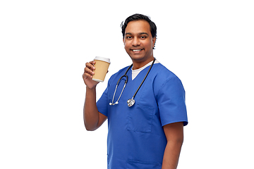 Image showing male doctor with stethoscope drinking coffee