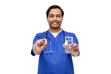 Image showing indian doctor with medicine and glass of water