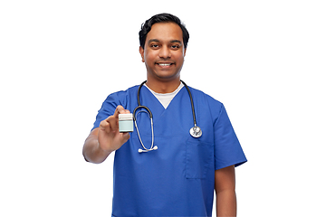 Image showing indian doctor or male nurse holding medicine