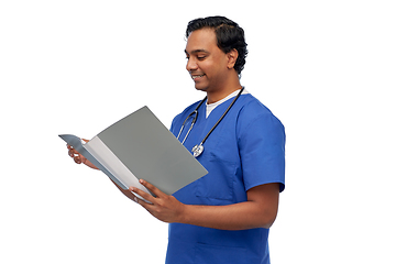 Image showing happy indian doctor with medical report in folder