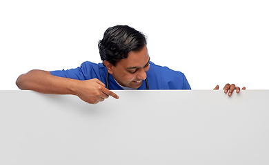 Image showing smiling male doctor or nurse with big white board