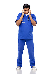 Image showing stressed doctor or male nurse having headache