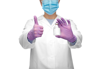 Image showing close up of doctor with medicine showing thumbs up