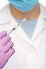 Image showing close up of doctor with syringe