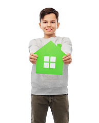 Image showing smiling boy holding green house icon