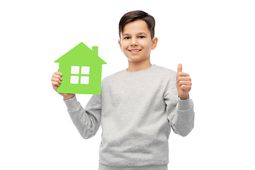 Image showing smiling boy with green house and showing thumbs up