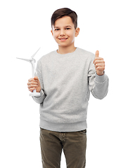 Image showing smiling boy with toy wind turbine