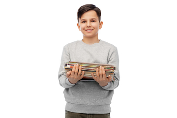 Image showing smiling boy with magazines sorting paper waste