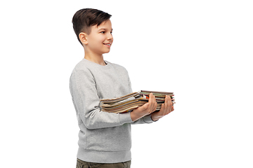 Image showing smiling boy with magazines sorting paper waste