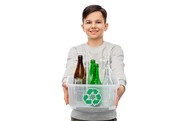 Image showing smiling boy sorting glass waste