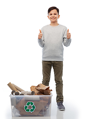 Image showing smiling boy sorting paper waste showing thumbs up