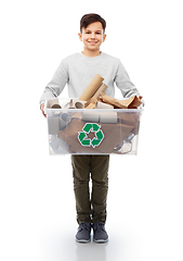 Image showing smiling boy sorting paper waste