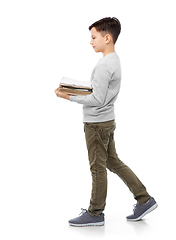 Image showing smiling boy with magazines sorting paper waste